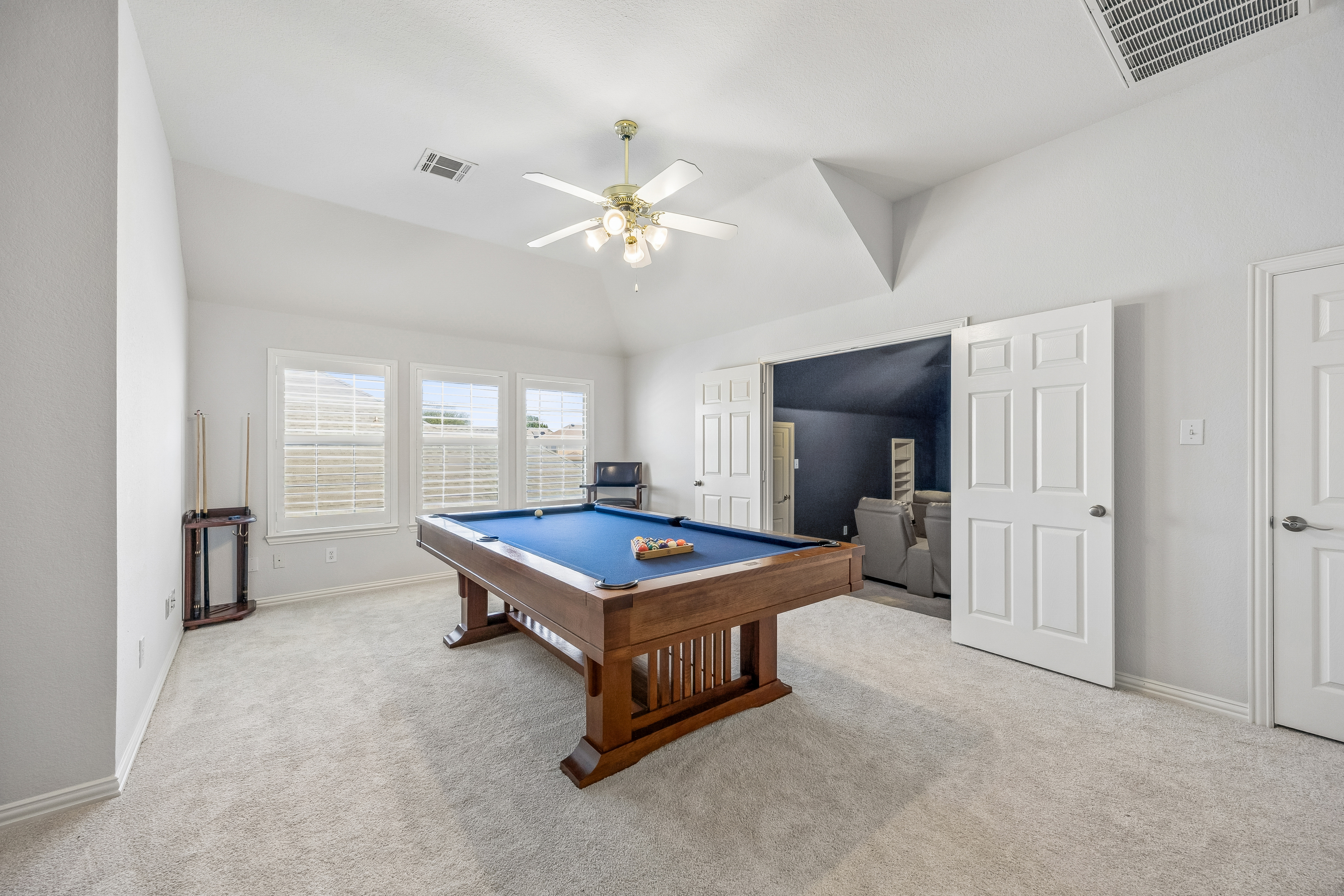 Billiards room with full-size pool table